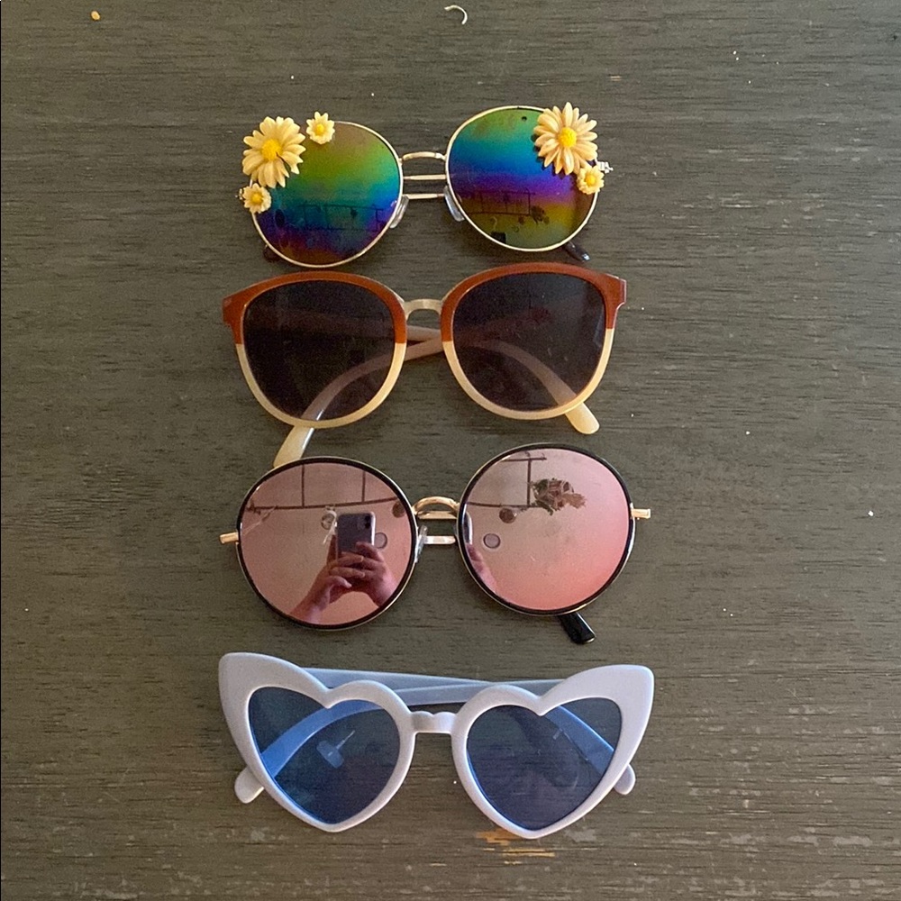 Lot of sunglasses. 4 pairs included